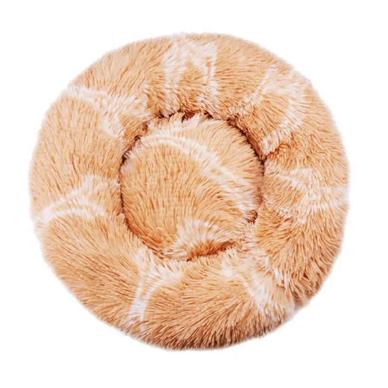 Round plush pet bed in beige with white accents, soft and cozy for cats or small dogs