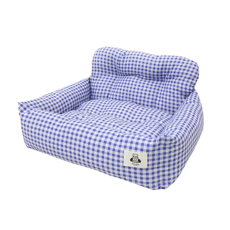 Blue and white plaid pet bed with cushioned sides and backrest on white background
