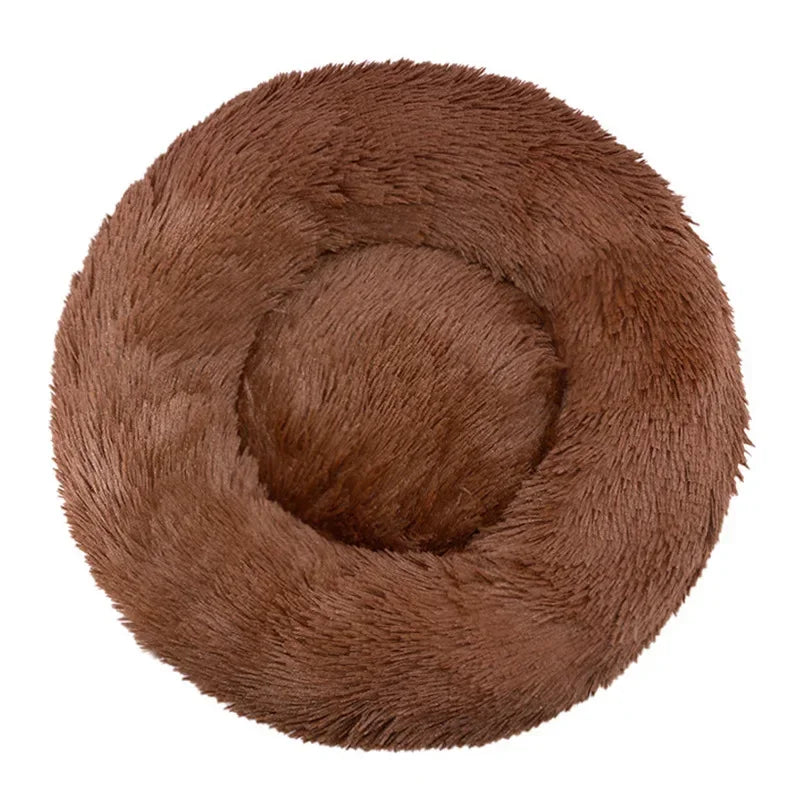 Round brown fluffy pet bed with raised edges on a white background