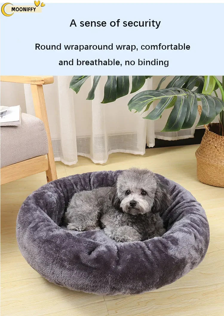 Small gray dog lying in a round plush pet bed with soft faux fur in a cozy room