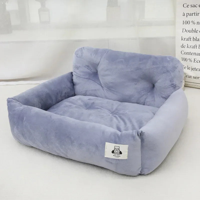 Plush light purple pet bed with raised sides and soft cushion on white background