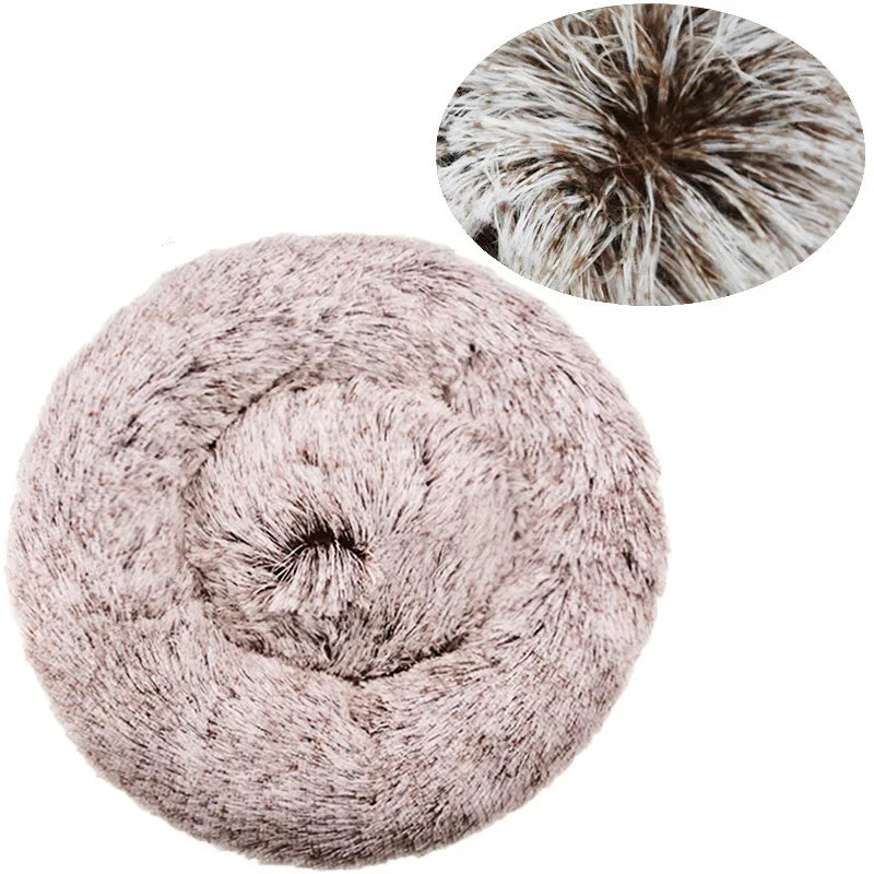 Round fluffy pet bed in light beige faux fur, shown with close-up of soft plush texture.