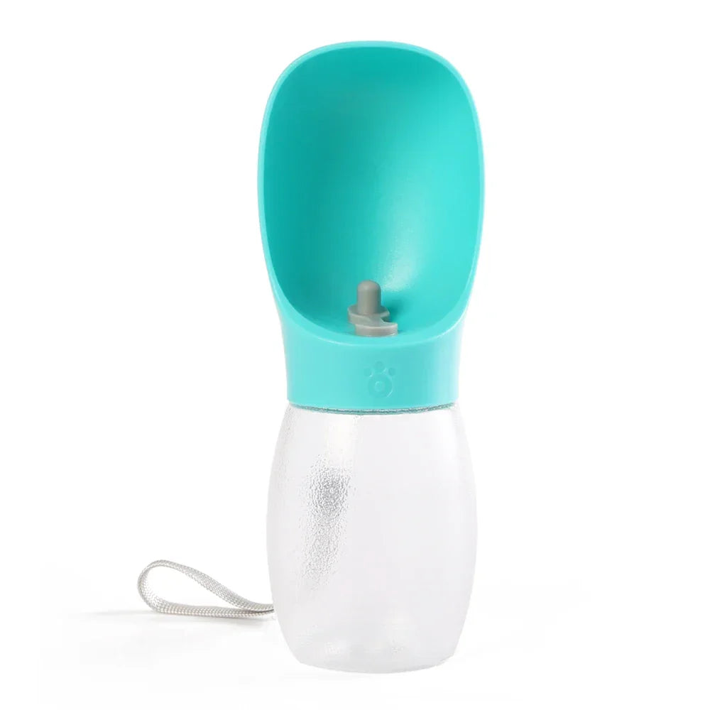 Portable pet water bottle with turquoise drinking bowl and wrist strap, isolated on white