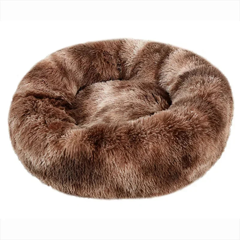 Brown fluffy round pet bed with soft faux fur texture on a white background