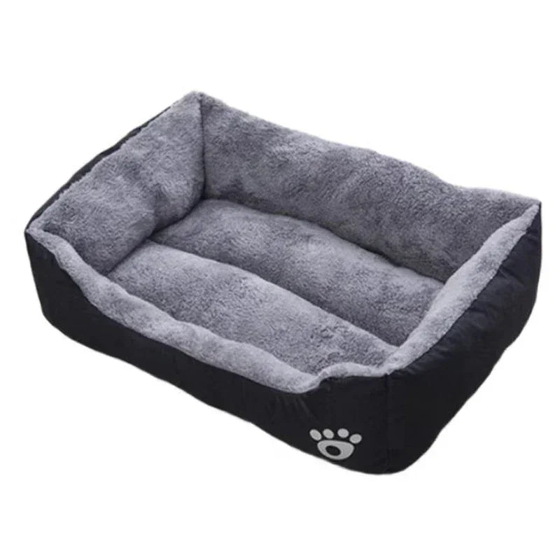 Rectangular gray plush pet bed with raised sides and a paw print design on the front