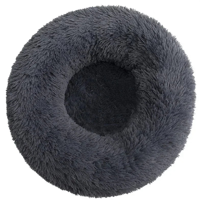Round gray fluffy pet bed with plush texture and raised rim