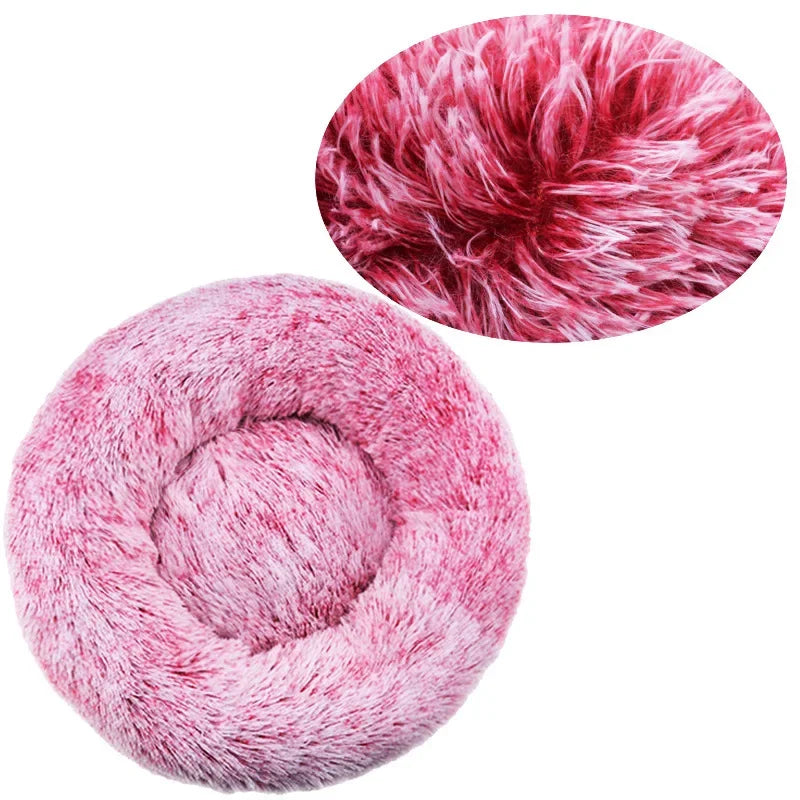 Round pink fluffy pet bed with close-up showing soft plush texture